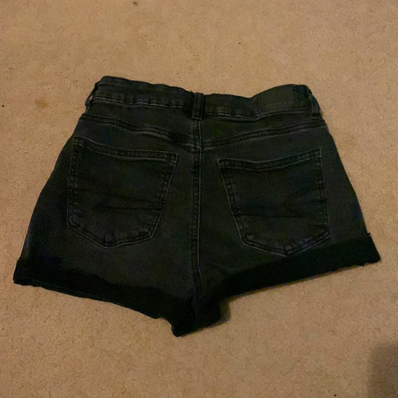 Black stretchy American Eagle jeans with a cross over waist - Picture 2 of 6